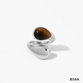 Silver adjustable ring with oval tiger eye stone inlay on a clean white background - Silver Tiger Eye Teardrop Ring (B568)