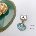 Close-up of light blue enamel charm with shell and agate on white background - Model 126-Blue Shell
