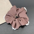 Brown satin scrunchie with white pearl trim on a dark wood background for hair styling - Pearl Style / Dusty Pink