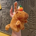 Brown capybara plush keychain with orange on head and rotating tail feature - Pull String Orange Capybara Brown
