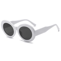 Retro oval frame sunglasses with white frame and dark lenses shown from 45-degree angle - White Frame Gray Lens