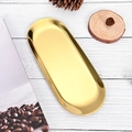 Elegant gold oval metal tray for aromatherapy candles on a rustic white wood background - Gold Tray 23*9.5cm