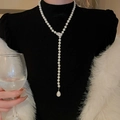 Detailed view of long Y-shaped necklace with leaf pendant and water-drop faux pearl - No.14 Leaf Pearl Style / Silver