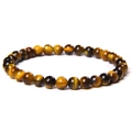 Close-up of natural tiger eye stone beads showing cat-eye effect and wood-like texture - 6mm Yellow Tiger Eye