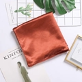 Elegant caramel orange satin square scarf with a smooth silk finish and glossy texture - Rust red