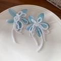 Detailed close-up of blue crystal flower earrings with beaded tassels on white ceramic - 31# Ear Buckle - Blue - Flower