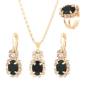 Detail of gold-plated jewelry set featuring black oval gems and sparkling rhinestones - Oval KC Gold Black Style (10263)