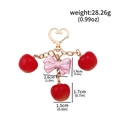 Pink bow and red cherry keychain with heart clasp and dimension measurement text - BG00139-02 Pink Bow Red Cherries Keychain (Rose Gold)