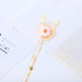Transparent sequin gel pen featuring orange daisy and reindeer antler topper design - Yellow Deer Daisy
