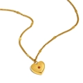 Collar con colgante de corazón bañado en oro de 18 quilates con circonita roja - Enero/Color Granate
