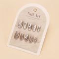 Detail of handmade cat-eye press-on nails with luxury rhinestones and pearl accents - By1723 / Glue Type