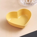 Yellow heart-shaped wheat straw seasoning dish with natural speckled texture finish - Yellow