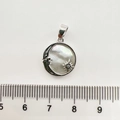 Close-up of 18K gold-plated celestial shell pendant with ruler showing size 1.8cm - 1 Piece / Silver Sun Moon Star White Shell