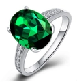 Elegant silver ring featuring a large oval green gemstone and cubic zirconia pave - Ur0527