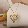 Elegant gold-plated hollow heart pendant necklace with colorful zircon stones in close-up - Hollow Heart With Multicolor Zirconia