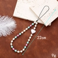 Detail of 22cm handmade phone strap with pearls and heart charm weighing 9g - Irregular Heart Style / Pale Blue