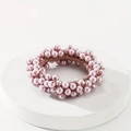 Detailed view of handmade lilac pink pearl elastic hair tie on a white podium - Lilac Pink
