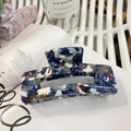 Large acetate hair claw clip with navy blue and marble pattern in a hollow square design - Dark Blue Red Marble