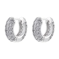 Detailed macro view of wide hoop earrings with paved white zircons in silver finish - Platinum White Zirconia