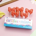 5-pack red bow birthday candles with dots in a blue gift box on pink background - Red Bow