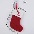 Red knitted Christmas stocking with letter L and measurement details - Letter L