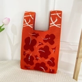 Handcrafted knit tote bag in vibrant orange featuring a red floral pattern design - Floral Leaf Orange