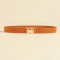 Elastic wide belt in orange brown featuring a gold-finished round metal buckle closure - Camel