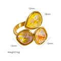 Ring aus Titanstahl in 14K Gold mit gelben Tropfen- und quadratischen Zirkonia - Gelb AB