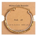 Detail of gold Morse code double-layer bracelet on branded gift card display - Fuck Off Gold