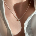 Elegant S925 silver necklace featuring a sparkling green zircon crown pendant on a model - Green Round Gem Style (XL1347)