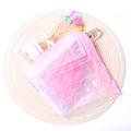 Pink translucent cherry blossom pencil case with zipper and glittery star patterns - Pink With Acrylic Handle