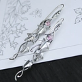 Close-up of vintage silver ivy leaf earrings with lavender gemstones and delicate vine texture - Pale Purple (I)