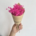 Close-up of mini pink dried baby's breath bouquet wrapped in vintage newspaper kraft paper - Vintage Mini Pink Gypsophila