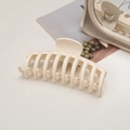 Detailed macro view of a large cream-colored matte hair claw with high-quality spring - Keel / Off-white