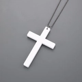 Detail of a white matte wooden cross pendant with dark grey industrial metal bead chain - White