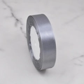 Single roll of 2.5cm grey polyester satin ribbon for Christmas gift DIY on marble surface - No. 1003