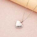 Silver heart locket necklace featuring vintage floral engraving on a textured pink surface - Steel Large Floral (29*29mm)