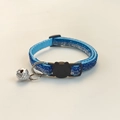 Detailed view of blue glitter woven pet collar with silver bell and black buckle - Metallic Blue
