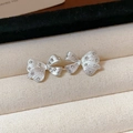 Macro shot of silver bow stud earrings with sparkling zircons on a beige velvet display - Rhinestone Bowknot Stud Earrings