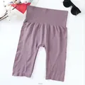 Women's seamless high-waist mauve athletic shorts with ribbed waistband and side text - One Size / Bottoms / Purple