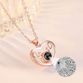 Macro detail of rose gold heart antler necklace with love projection stone element - Reindeer Heart Rose Gold