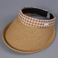 Detail of the woven straw sun hat with brown gingham fabric edge and a side decorative label - M (56-58cm) / Brown
