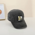Close-up of kids denim baseball cap featuring yellow excavator embroidery patch - 52cm (2-5 Years) / Black