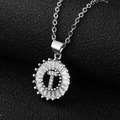 Macro shot of silver letter T pendant featuring baguette-cut cubic zirconia and steel chain - Silver Letter T