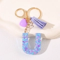 Letter U resin keychain with purple heart pendant and tassel in a blue glitter finish - Letter U