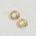 Golden smiley face hoop earrings with twist chain design on a white textured background - Black (ES2227)