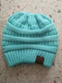 Winter mint green knit ponytail beanie featuring a classic brown leather C.C brand tag - One Size / Lake Blue
