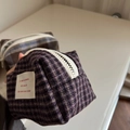 Macro shot of plaid tweed makeup bag with white zipper and vintage fabric label - Purple Small Plaid