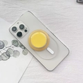 Dettaglio del supporto MagSafe giallo magnetico su una custodia per cellulare trasparente - Staffa Magnetica Base Opaca / Giallo