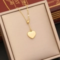 Detailed close-up of a golden heart pendant necklace on a champagne jewelry box display - Polished Gold Style (4#)